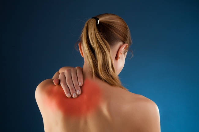 Woman massaging pain back